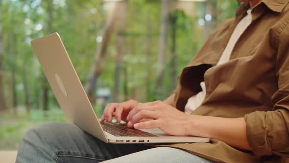 Man Using Laptop Outdoor Closeup