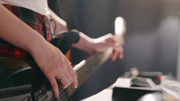 Close Up of Female Hands Recording Song