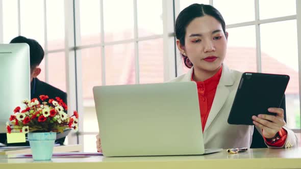 Business People Working at Table in Modern Office