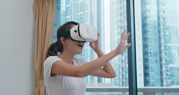 Woman Play Boxing Game and Wearing VR Device