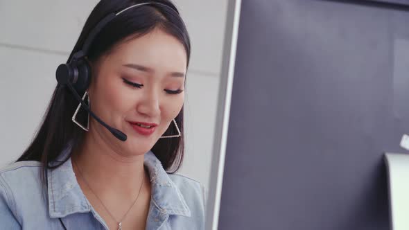 Customer Support Agent or Call Center with Headset Talking to Customer on Phone