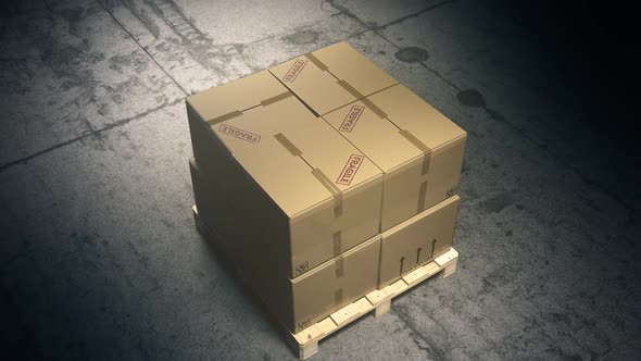 A stack of cardboard boxes on a pallet in the warehouse waiting for a forklift.