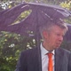Businessman Sheltering Underneath a Broken Umbrella in the Rain - VideoHive Item for Sale