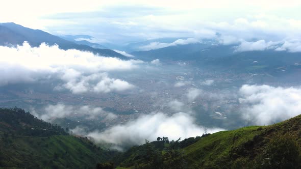 Fog and clouds cover the city of Medellin in Colombia in a timelapse from the surrounding mountains