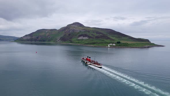 A Paddle Steamer Taking Tourists on a Coastal Tour