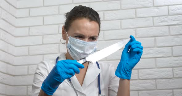 Medical Worker with Sharp Knife