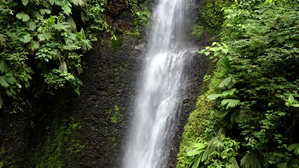 Still video of a waterfall in a tropical paradise