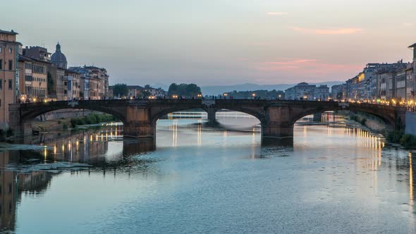 Twilight Sky Scene of Ponte Santa Trinita Holy Trinity Bridge Day To Night Timelapse Over River Arno