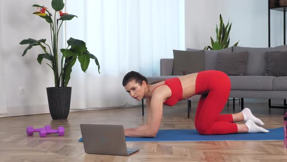 Fit Woman Does Exercise for Buttocks Raises Leg Up on Fitness Mat Study Online