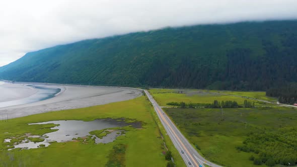 4K Cinematic Drone Video (truck left) of Mountains Surrounding Turnagain Arm Bay Looking Over Seward