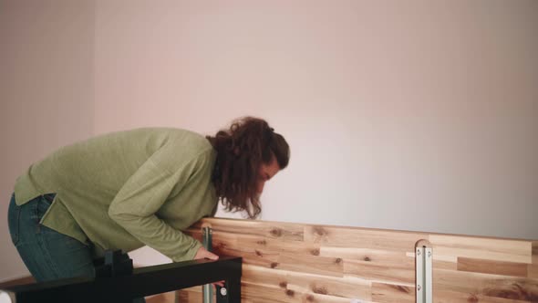 People Lift And Turn Up The Newly Built DIY Table Inside The House. - close up