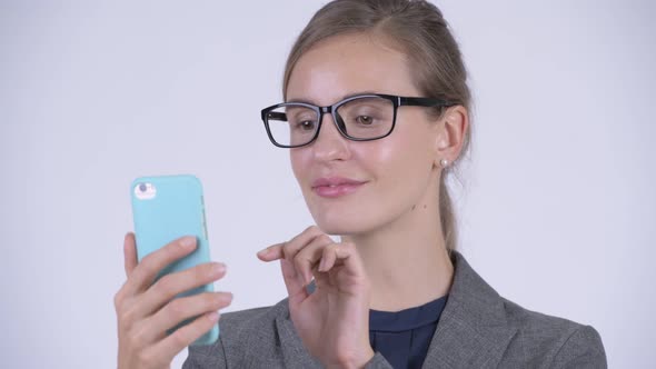 Face of Young Happy Businesswoman Using Phone