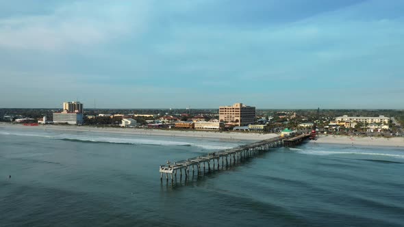 Aerial View Of Jacksonville Beach Pier And Shoreline In Florida, USA. Fishing Pier Temporarily Close