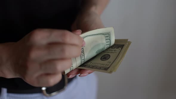 Woman Counting Money US Dollars