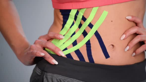 Kinesio Tape on Girl Belly