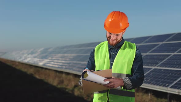 The Engineer is Inspecting Solar Panels