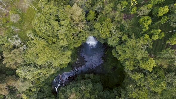 Flying Above Tropical Jungle Waterfall