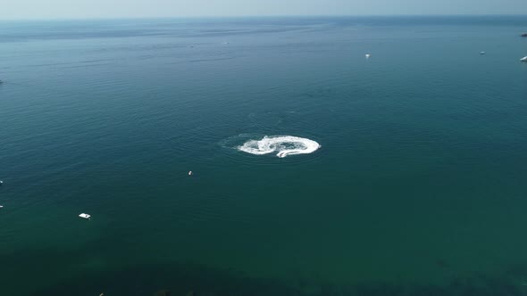 Aerial Top Down View of Water Foam Trace with Nice Deep Blue Shade of Ocean