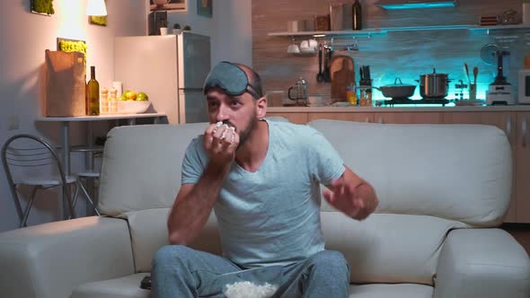 Concentrated Man Sitting in Front of Television While Watching Fun Shows Series