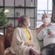 happiness asian senior couple sit relax morning conversation on sofa in living room - VideoHive Item for Sale