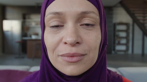 Portrait of Charming Arab Woman in Hijab Smiling Indoors