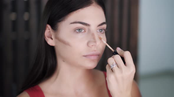 Hands of Young Makeup Artist Paint with Brush the Convex Areas