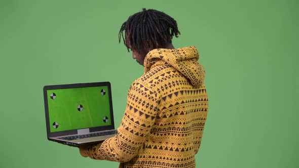 Young Handsome African Man Using Laptop