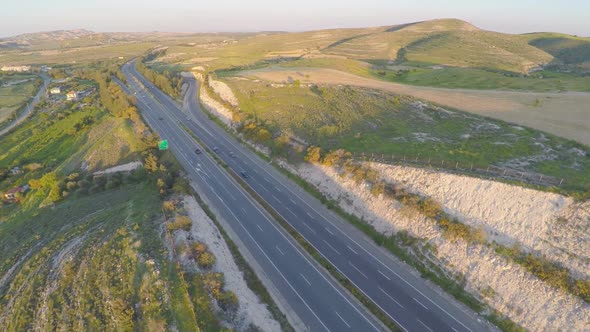 Car Travel on Vacation. Aerial Shot of Amazing Green Landscape, Road Traffic