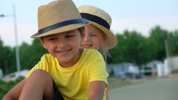 Little Boy and Girl Is Smiling at the Camera