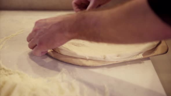 Man Prepping Pizza Dough