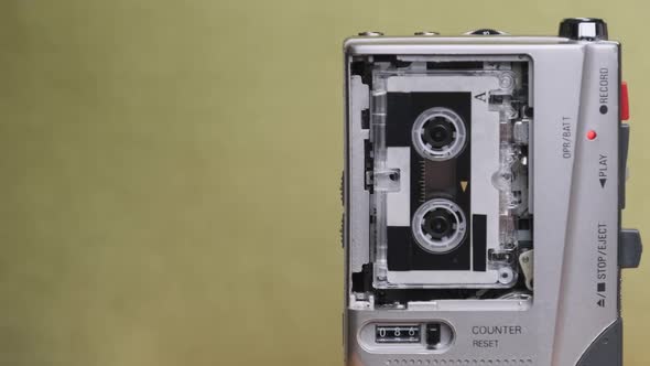 Portable Retro Tape Recorder with Micro Cassette Rec Sound on Yellow Background