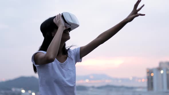 Woman Looking Though Vr Device in The Evening 