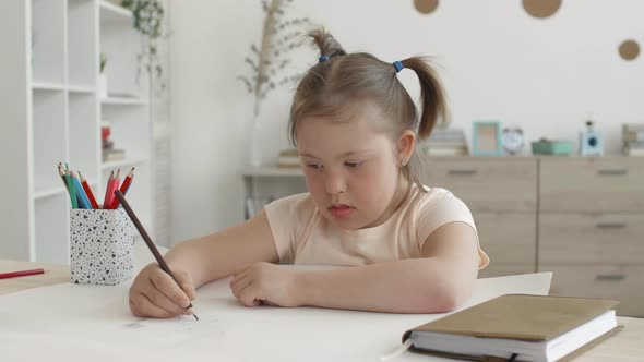 Female Handicapped Schoolkid Drawing