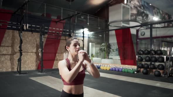 Motivated Athlete Doing Lunges As Warm Up Before Training