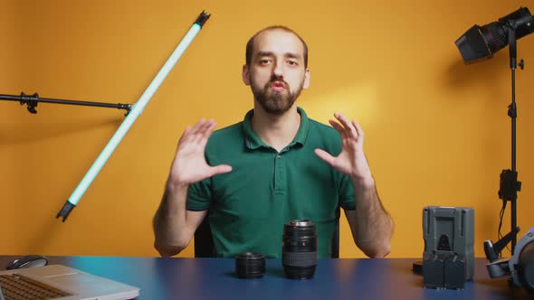 Photographer Holding Lenses