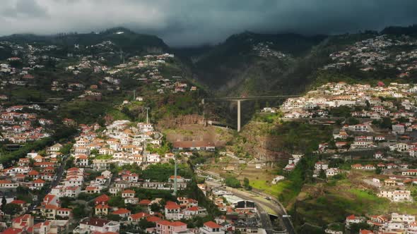 Drone Footage of Sunrise Over Picturesque Village in Lush Green Island