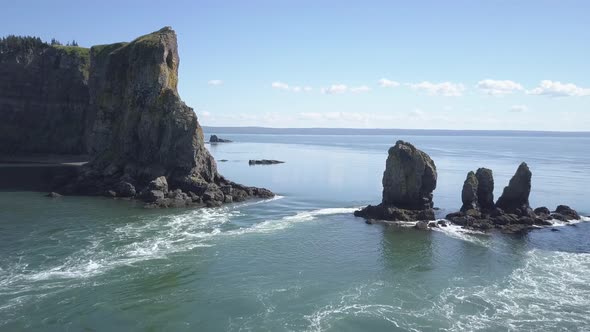 Flying over rushing tidal waters around the rocky outcrops of Cape Split, Nova Scotia.