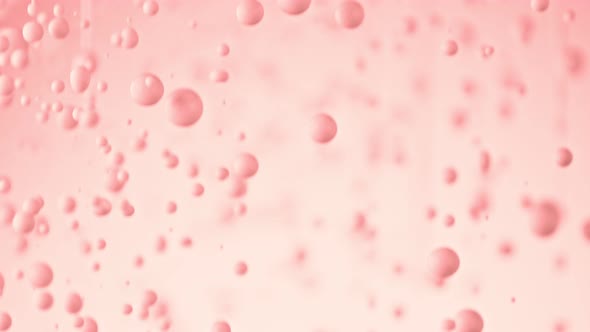 Super Slow Motion Shot of Dripping Pink Droplets at 1000 Fps