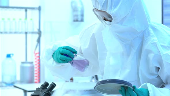 Scientists wearing protective clothing