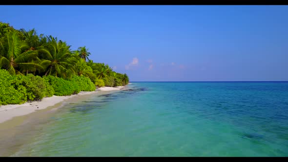 Aerial drone tourism of perfect tourist beach journey by blue sea and white sand background of a day