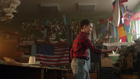 White American Boy Playing in Model Airplane School