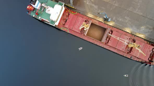 Cargo ship sand loading process aerial view