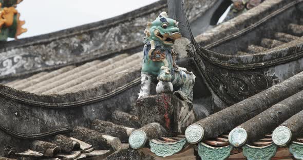 Traditional chinese building with statue