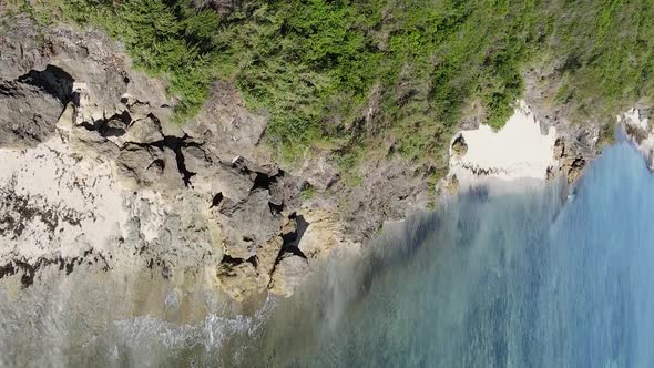 Vertical Video of the Ocean Near the Coast of Zanzibar Tanzania Aerial View