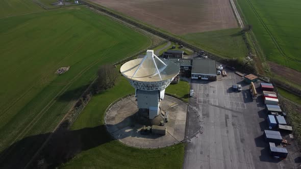 Top down aerial birds eye view shot of observatory with radar antenna