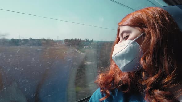 Young Girl Sleeps on the Train with Ffp2 Mask While Traveling for Work