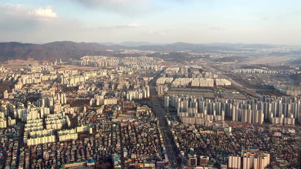 Timelapse Endless Buildings in City of Seoul Surround Hills