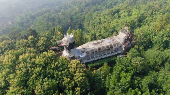 Famous Chicken Church in lush green tropical forest on Java, Indonesia, aerial