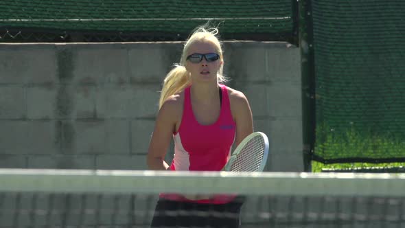 Women playing tennis.