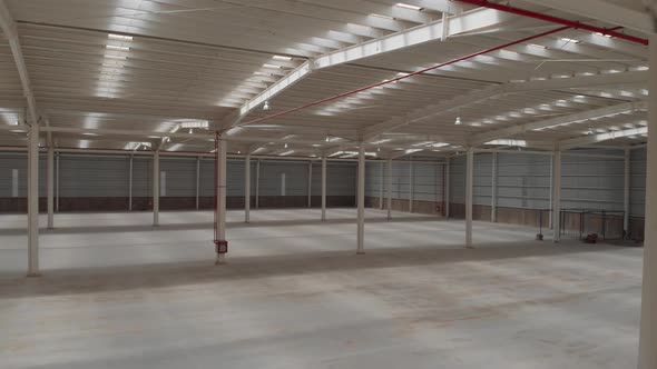 Interior of an Empty Warehouse Camera Sliding Backwards